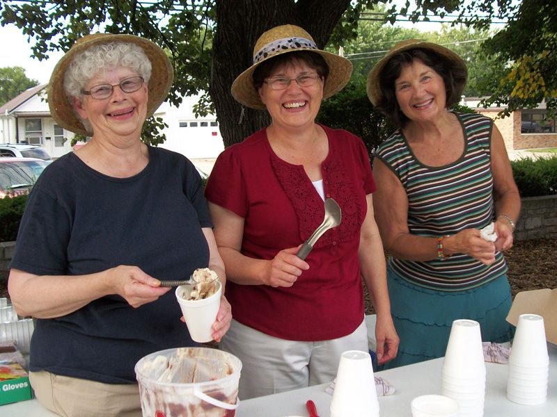 Friends members serve ice cream at the summer reading club concert